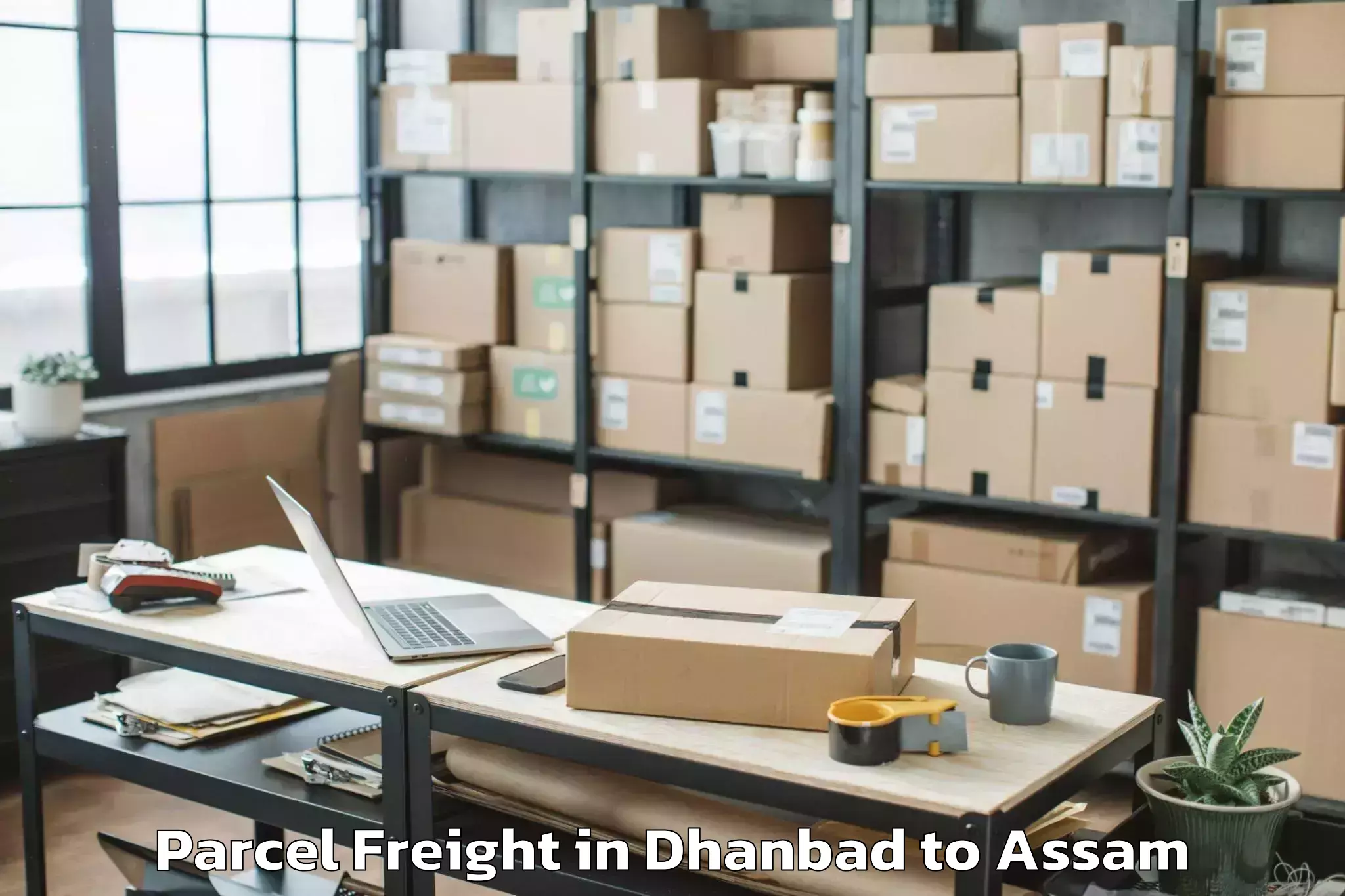 Top Dhanbad to Barpeta Road Parcel Freight Available